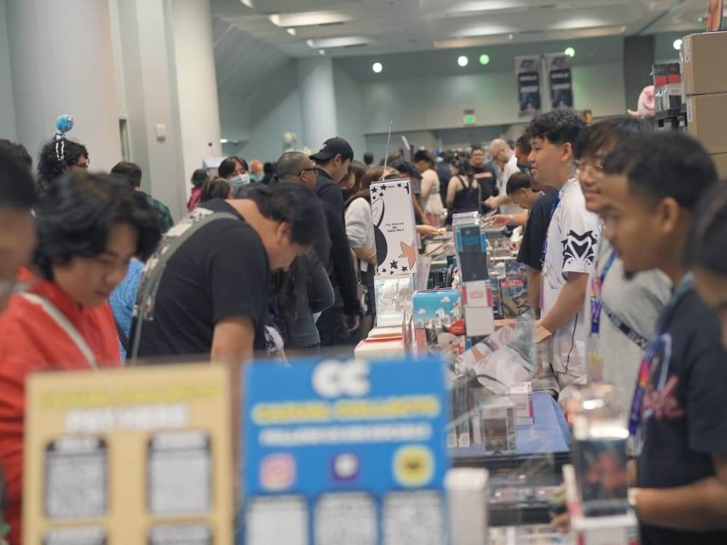 Inside IMPULSE UNIVERSE: The Pop Culture Phenomenon That Called Santa Clara Home A bustling convention floor filled with attendees browsing various booths and merchandise in Santa Clara, California.