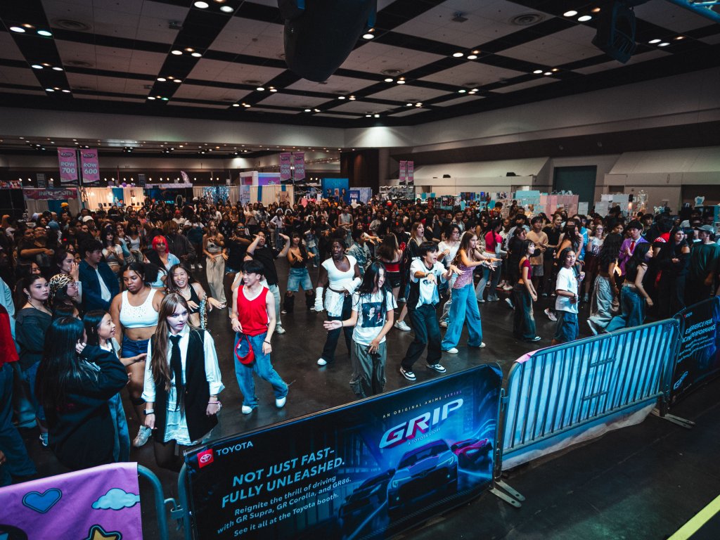 Inside IMPULSE UNIVERSE: The Pop Culture Phenomenon That Called Santa Clara Home A vibrant dance scene at a convention center, featuring a large crowd dancing and enjoying the event in Santa Clara, California.