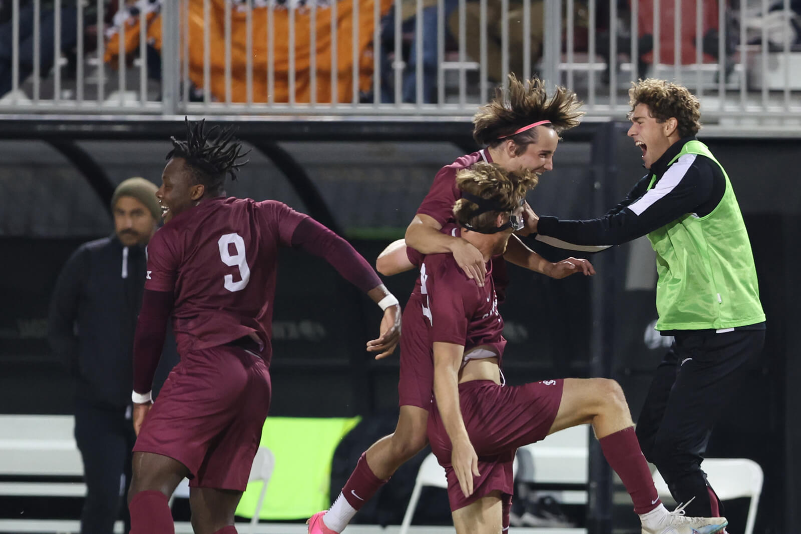 Sports Tourism Soccer players celebrating on the pitch