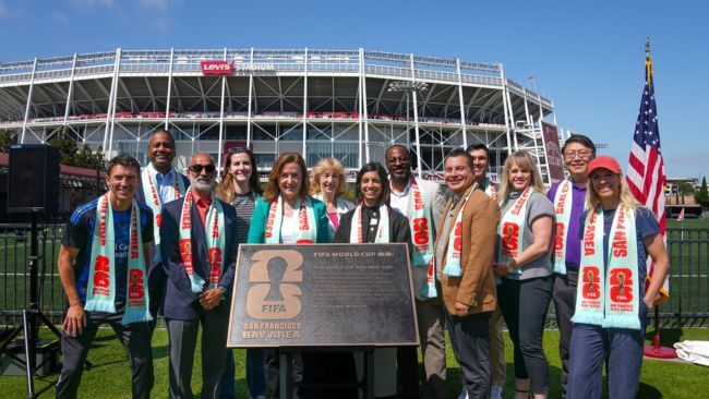What It Really Takes to Host the Super Bowl in Santa Clara 2026 A group of diverse individuals celebrate at a FIFA World Cup event site in Santa Clara, California.