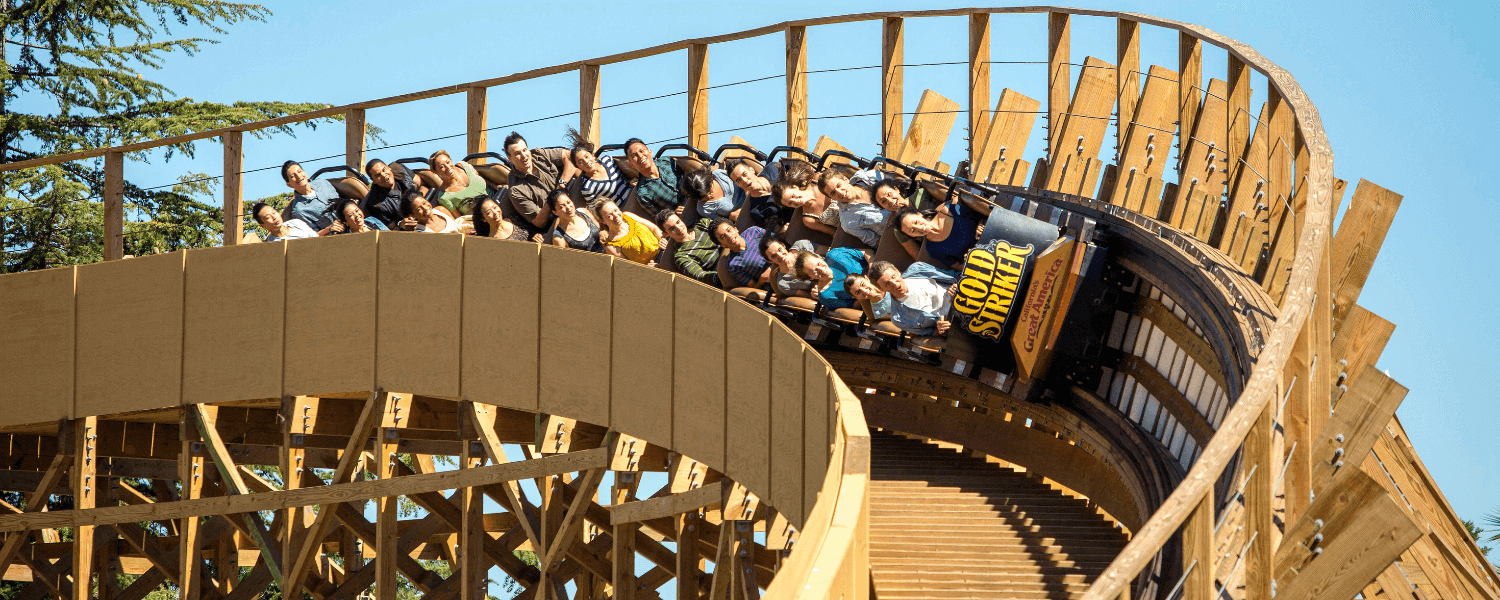 A thrilling roller coaster ride with excited passengers enjoying the twists and turns in Santa Clara, California.