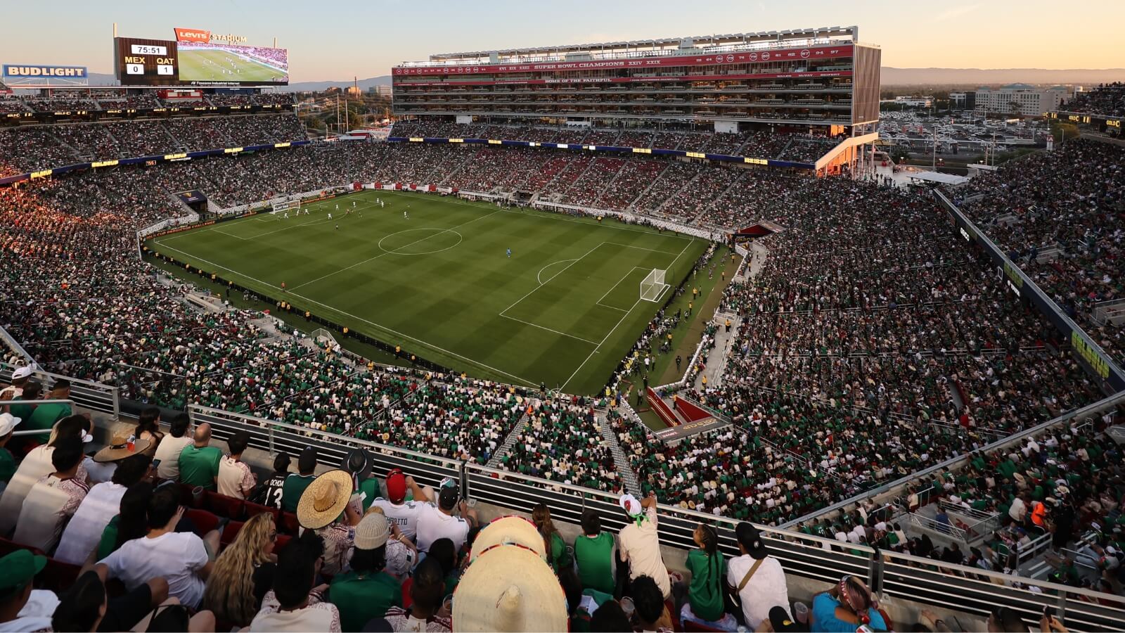 A vibrant soccer stadium filled with enthusiastic fans, watching a match under a twilight sky in Santa Clara, California.