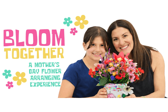 May Events in Santa Clara 2026 A mother and daughter smiling while holding a colorful flower arrangement in a decorated vase in Santa Clara, California.