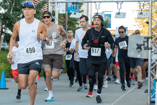 Monster Dash and Bash 5K Walk/Run A group of runners participating in a race, wearing bib numbers on their shirts in Santa Clara, California.